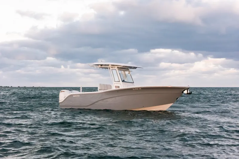 Slide: The Image of 2025 Sea Fox 268 Commander boat on open water under cloudy sky. - 2