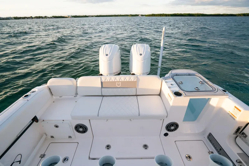 Slide: The Image of 2025 Sea Fox 268 Commander boat interior with dual engines on open water. - 21