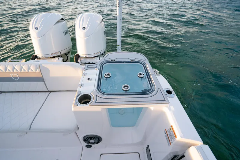 Slide: The Image of 2025 Sea Fox 268 Commander boat with dual engines and fishing station on water. - 24