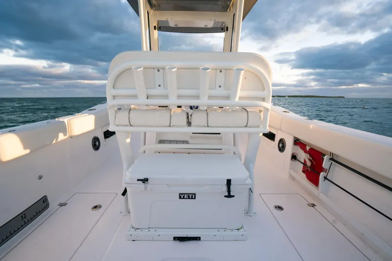 Slide: The Image of 2025 Sea Fox 268 Commander boat interior with Yeti cooler, ocean view. - 26