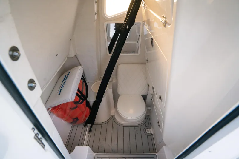 Slide: The Image of Interior of 2025 Sea Fox 268 Commander boat with toilet and storage space. - 28