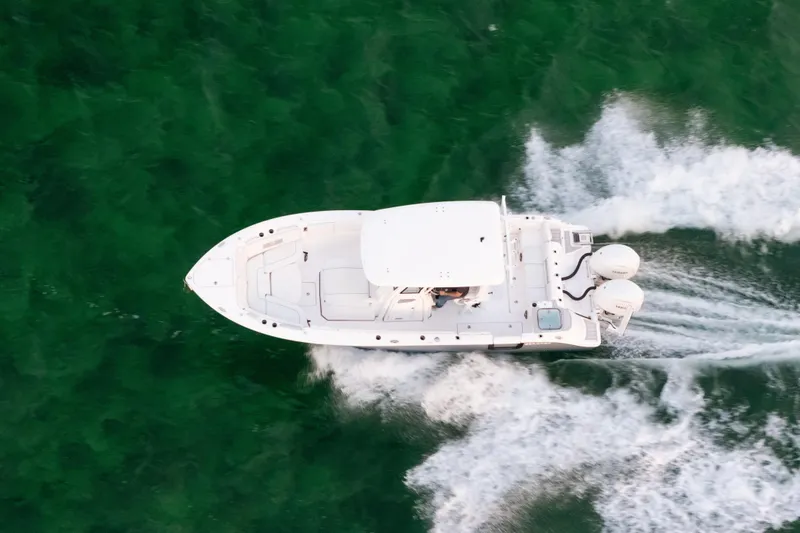 Slide: The Image of Aerial view of 2025 Sea Fox 268 Commander boat cruising on green water. - 8