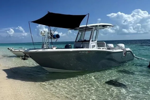 Slide: The Image of 2025 Sea Fox 226 Commander boat anchored on clear tropical waters. - 9