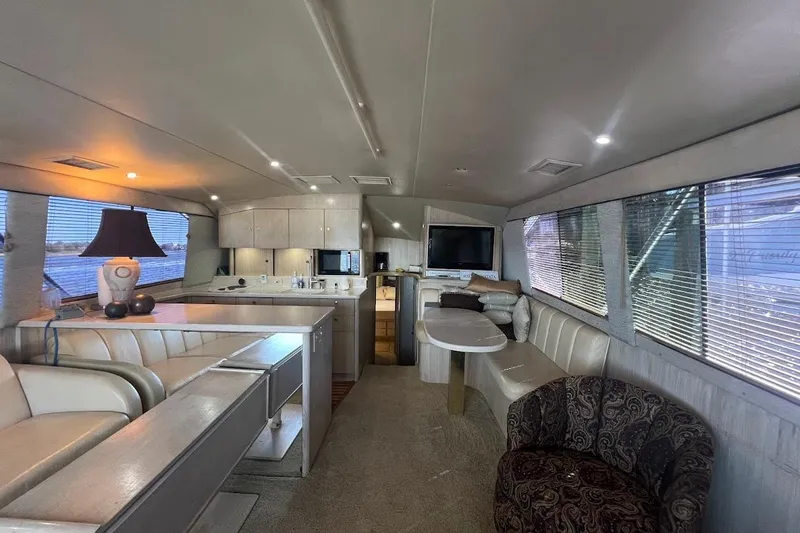 Slide: The Image of Interior of 1996 Ocean Yachts 48 Super Sport with wooden flooring and modern cabinetry. - 13