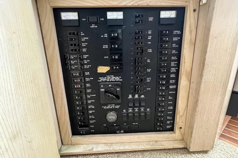 Slide: The Image of Cozy bedroom in 1996 Ocean Yachts 48 Super Sport with elegant bedding and compact TV. - 21