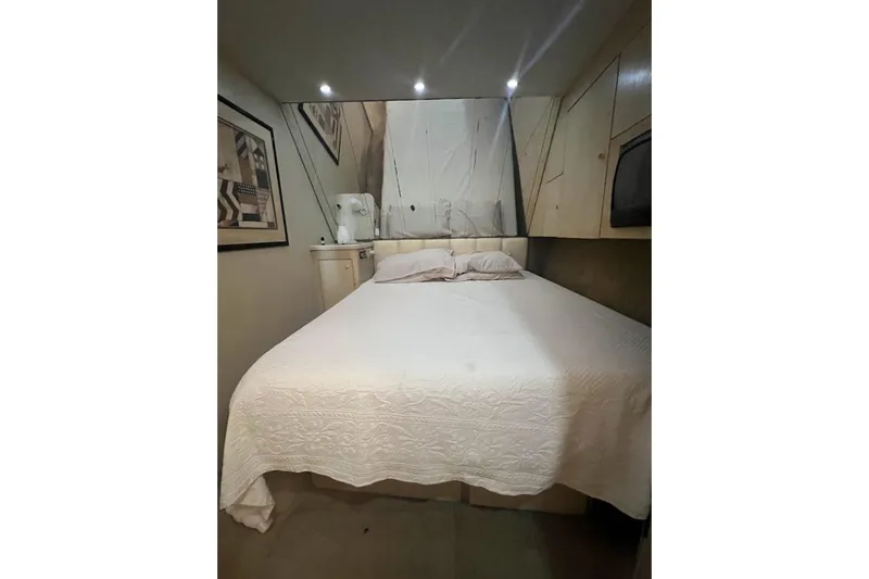 Slide: The Image of Bathroom interior of 1996 Ocean Yachts 48 Super Sport with shower and wooden flooring. - 23