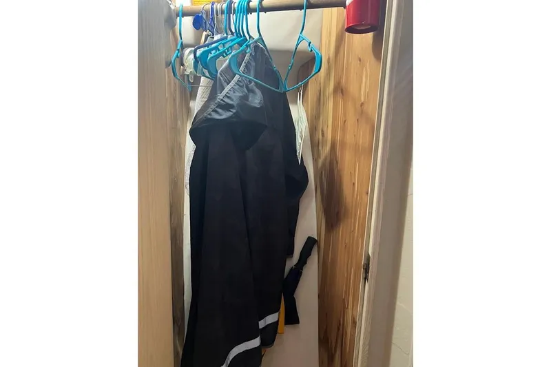 Slide: The Image of Interior cabin of 1996 Ocean Yachts 48 Super Sport with bed and storage. - 25