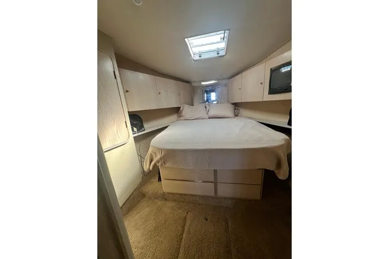 Slide: The Image of Bathroom interior of 1996 Ocean Yachts 48 Super Sport with sink and shower. - 26