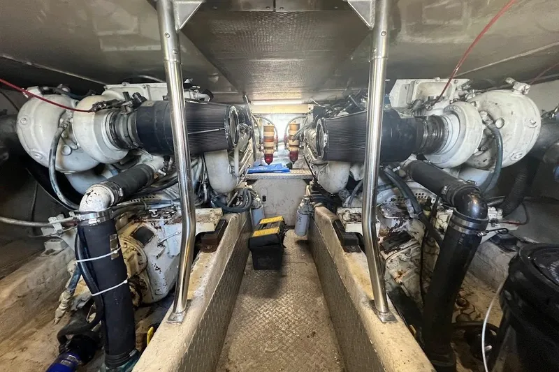 Slide: The Image of Engine room of 1996 Ocean Yachts 48 Super Sport, showcasing mechanical components. - 31