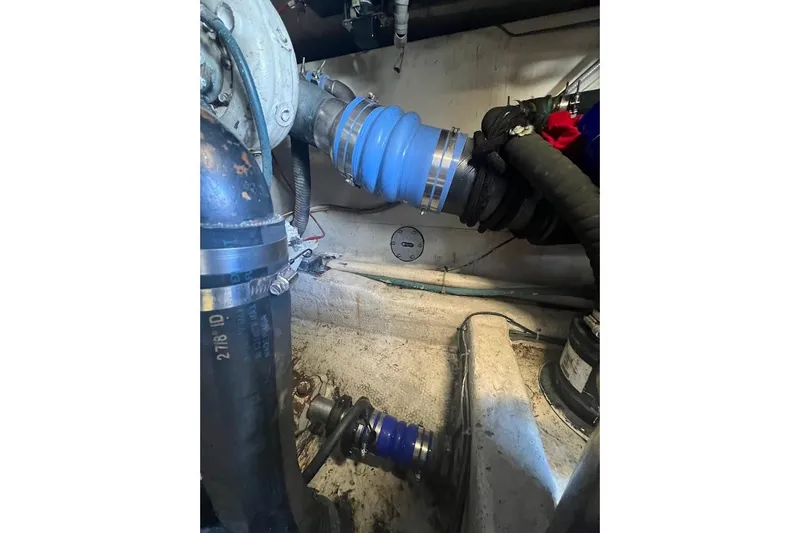 Slide: The Image of Engine room of a 1996 Ocean Yachts 48 Super Sport, showcasing mechanical components and filters. - 34