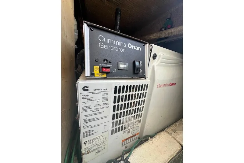 Slide: The Image of 1996 Ocean Yachts 48 Super Sport helm with steering wheel and navigation controls. - 36