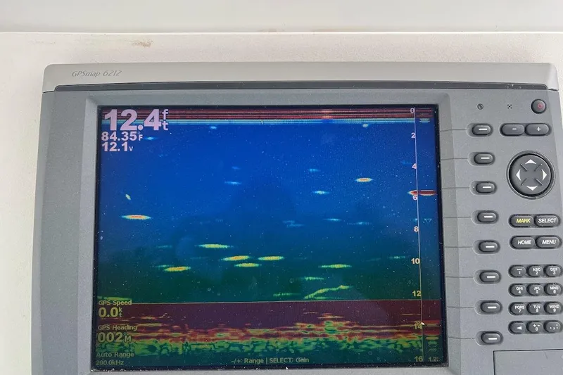 Slide: The Image of Simrad autopilot display on 1996 Ocean Yachts 48 Super Sport boat dashboard. - 39