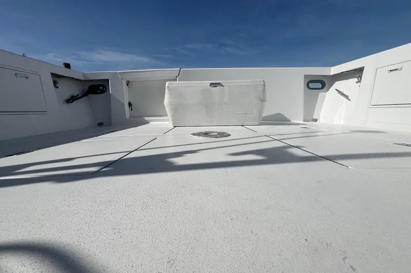 Slide: The Image of 1996 Ocean Yachts 48 Super Sport deck, spacious and clean under a clear blue sky. - 45