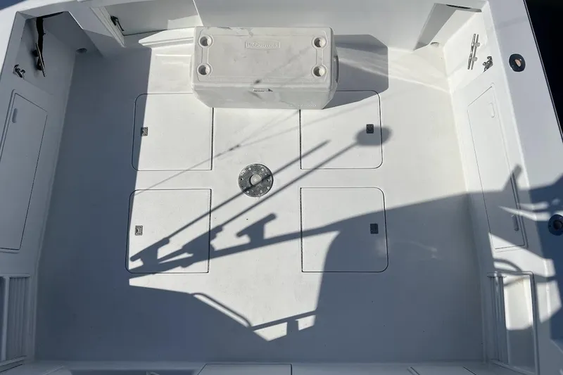 Slide: The Image of 1996 Ocean Yachts 48 Super Sport deck with storage hatches and cooler. - 47