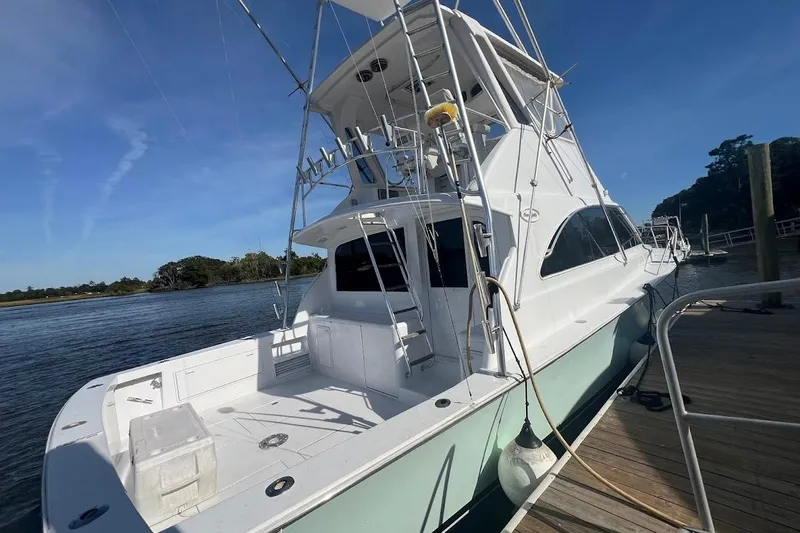 Slide: The Image of Luxurious interior of a 1996 Ocean Yachts 48 Super Sport, featuring modern amenities and elegant decor. - 5