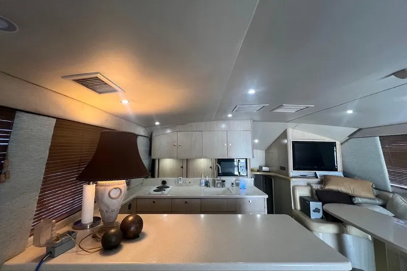 Slide: The Image of Luxurious interior of a 1996 Ocean Yachts 48 Super Sport with modern amenities and elegant design. - 6