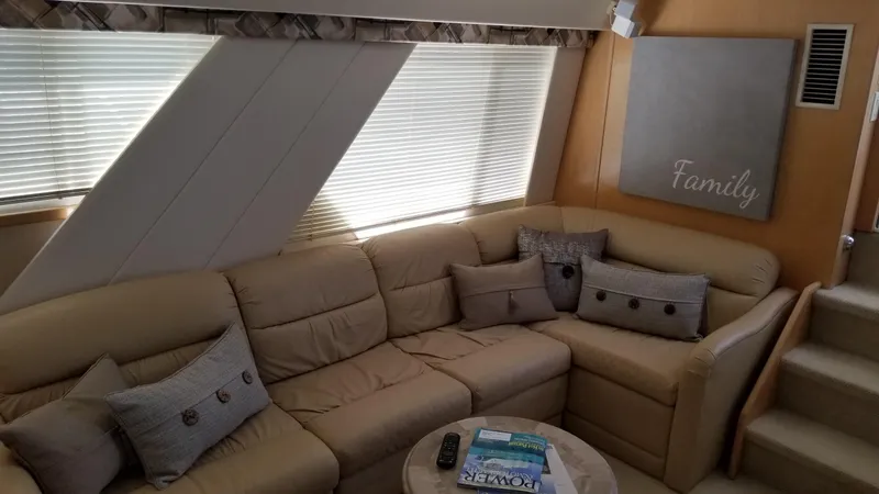 Slide: The Image of Interior of 1998 Carver 445 Aft Cabin Motor Yacht with beige sofa and decor. - 26