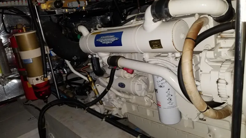 Slide: The Image of Engine room of 1998 Carver 445 Aft Cabin Motor Yacht, showcasing detailed machinery. - 45