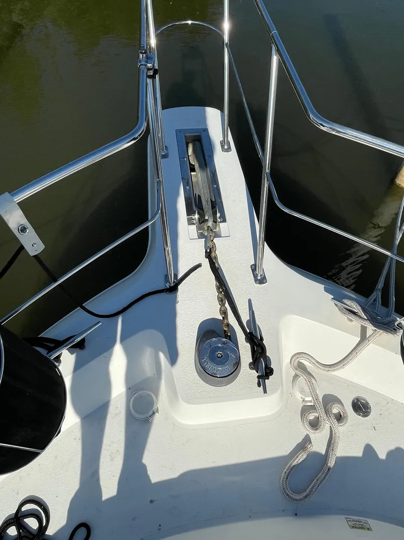 Slide: The Image of Bow of 1998 Carver 445 Aft Cabin Motor Yacht with anchor and railing. - 7