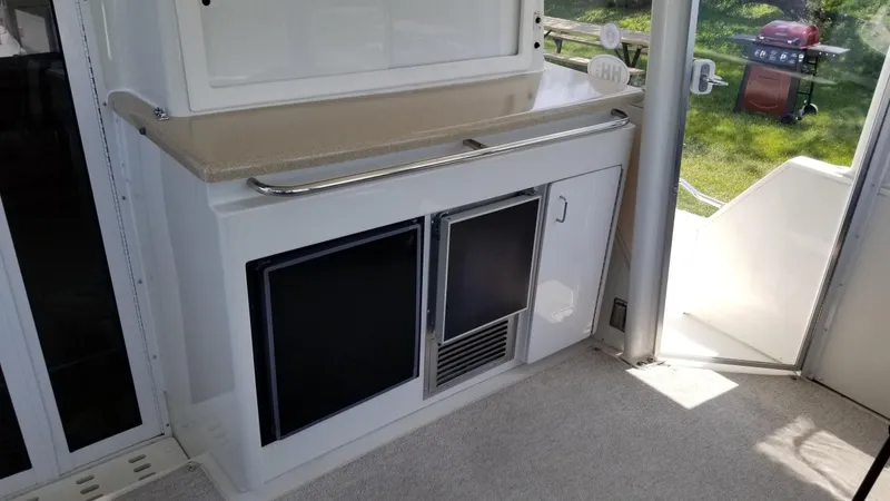 Slide: The Image of Interior of 1998 Carver 445 Aft Cabin Motor Yacht with kitchenette and storage. - 8