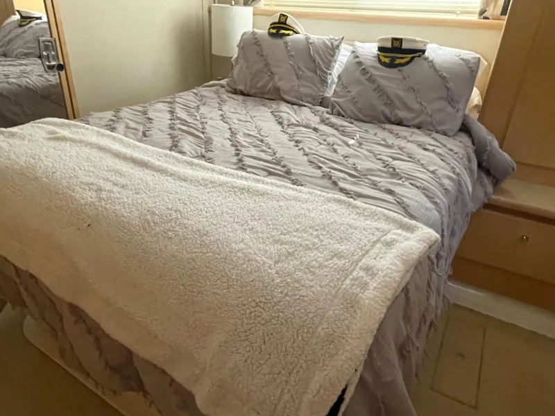 Slide: The Image of Cozy bedroom in 1998 Carver 445 Aft Cabin Motor Yacht. - 34