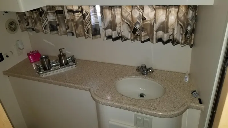 Slide: The Image of 1998 Carver 445 Aft Cabin Motor Yacht bathroom with sink and countertop. - 42