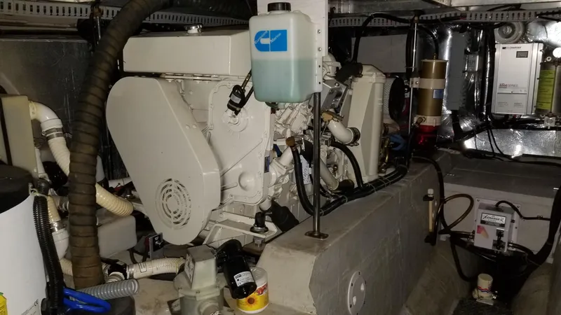 Slide: The Image of Engine room of 1998 Carver 445 Aft Cabin Motor Yacht, showcasing mechanical components. - 44