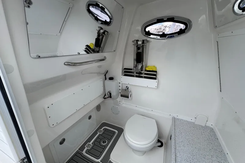 Slide: The Image of 2025 Tidewater 302 CC Adventure boat interior with modern bathroom amenities. - 106