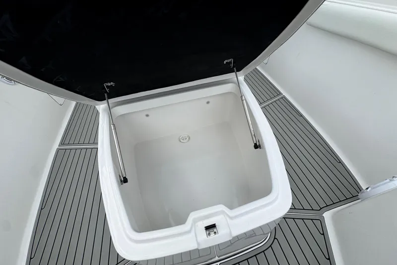 Slide: The Image of Open storage compartment on 2025 Tidewater 302 CC Adventure boat, featuring sleek design and ample space. - 109