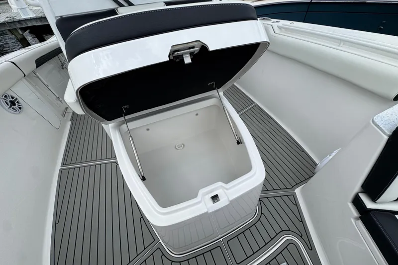 Slide: The Image of 2025 Tidewater 302 CC Adventure boat with open storage compartment on deck. - 110