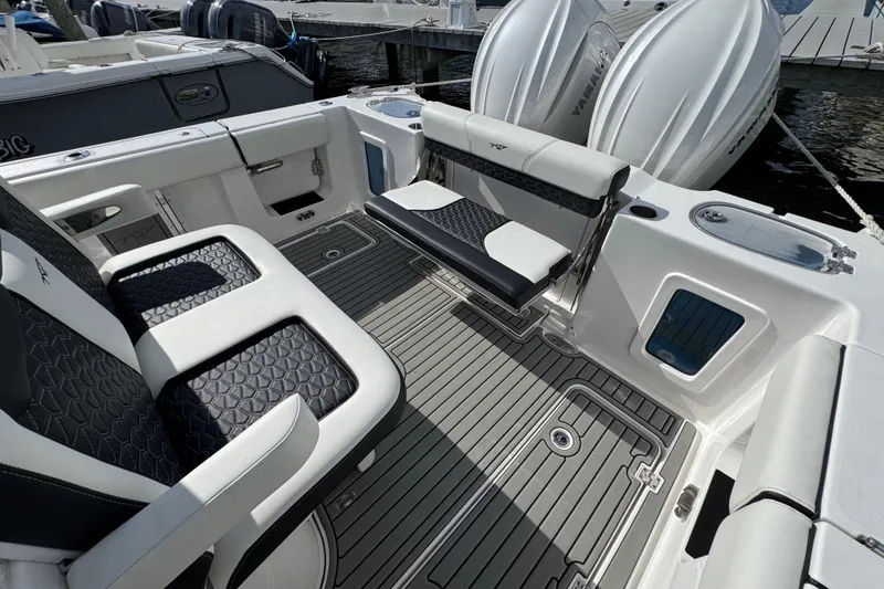 Slide: The Image of 2025 Tidewater 302 CC Adventure boat interior with sleek seating and modern design. - 25