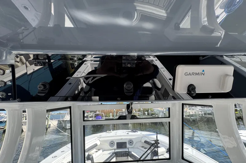 Slide: The Image of 2025 Tidewater 302 CC Adventure boat dashboard with Garmin navigation system. - 37