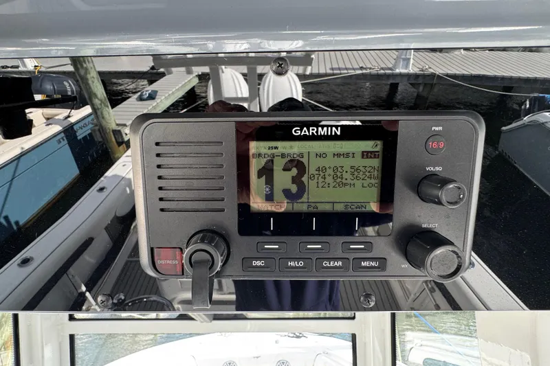 Slide: The Image of Garmin marine radio on 2025 Tidewater 302 CC Adventure boat dashboard. - 39