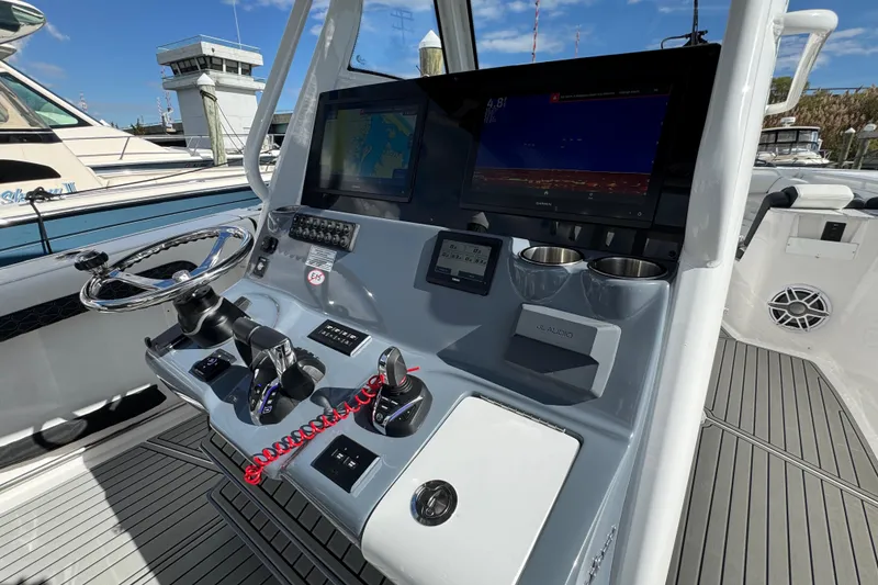 Slide: The Image of Helm of 2025 Tidewater 302 CC Adventure boat with advanced navigation system. - 42