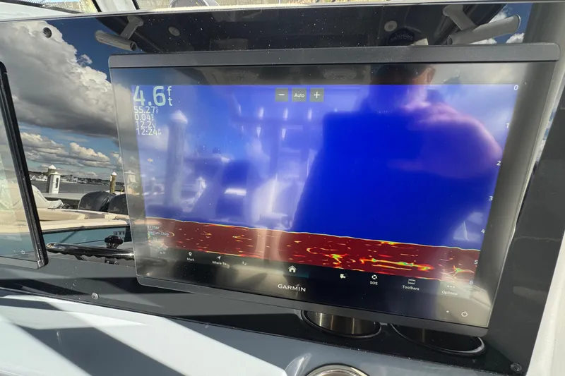Slide: The Image of Garmin marine display on 2025 Tidewater 302 CC Adventure boat, showing depth and sonar data. - 45