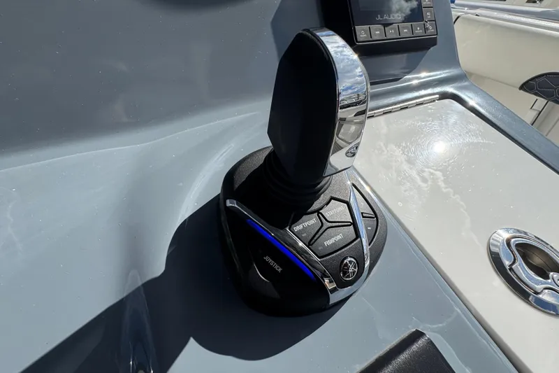 Slide: The Image of Joystick control on 2025 Tidewater 302 CC Adventure boat dashboard. - 47
