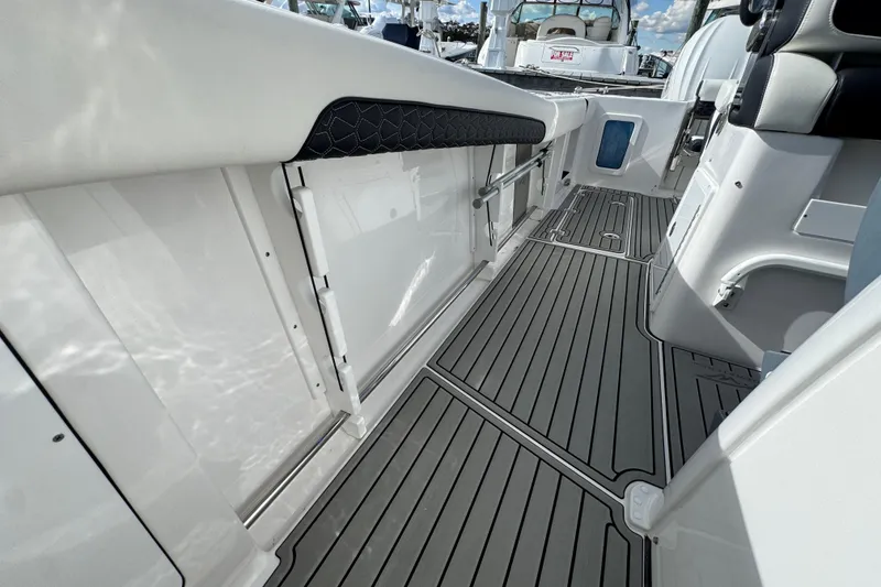Slide: The Image of 2025 Tidewater 302 CC Adventure boat interior with sleek flooring and modern design. - 60