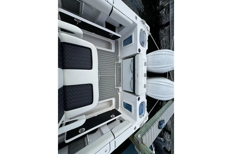 Slide: The Image of 2025 Tidewater 302 CC Adventure boat interior with sleek seating and modern design. - 67