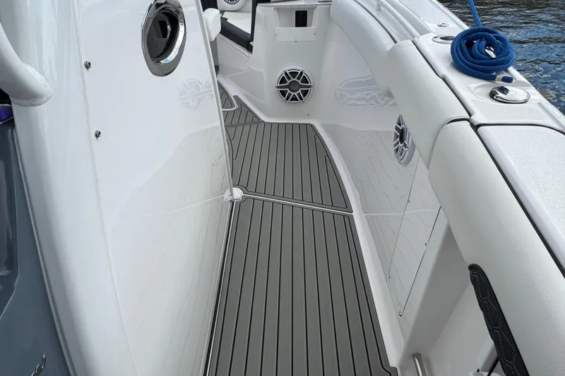 Slide: The Image of 2025 Tidewater 302 CC Adventure boat deck with sleek design and marine speakers. - 70