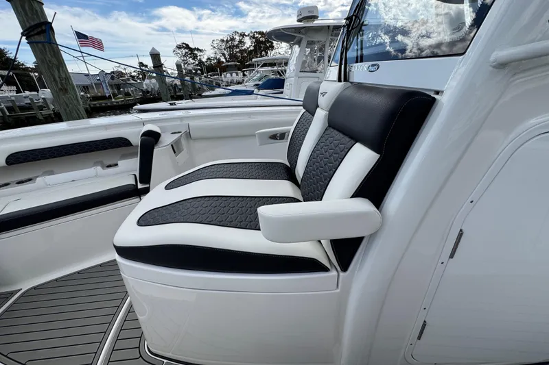 Slide: The Image of 2025 Tidewater 302 CC Adventure boat with luxurious seating and sleek design. - 77