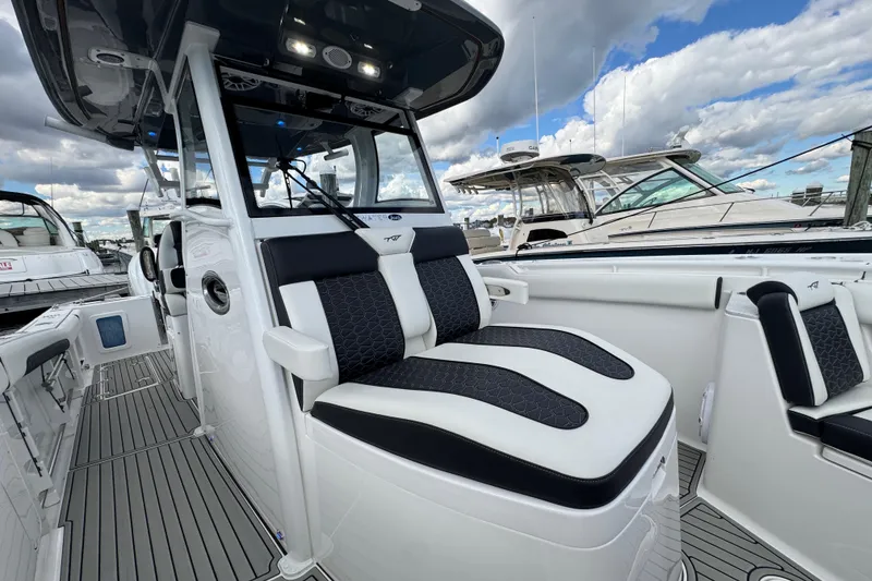 Slide: The Image of 2025 Tidewater 302 CC Adventure boat interior with sleek seating and modern design. - 78