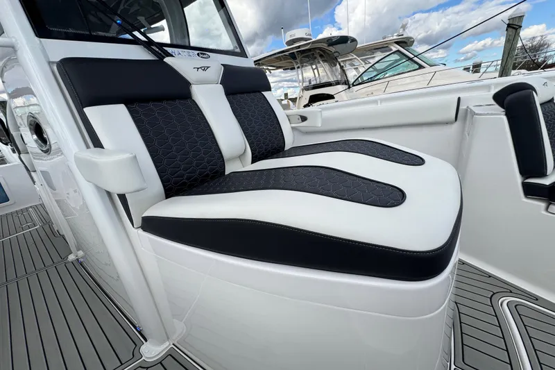 Slide: The Image of 2025 Tidewater 302 CC Adventure boat with sleek, modern seating design. - 79