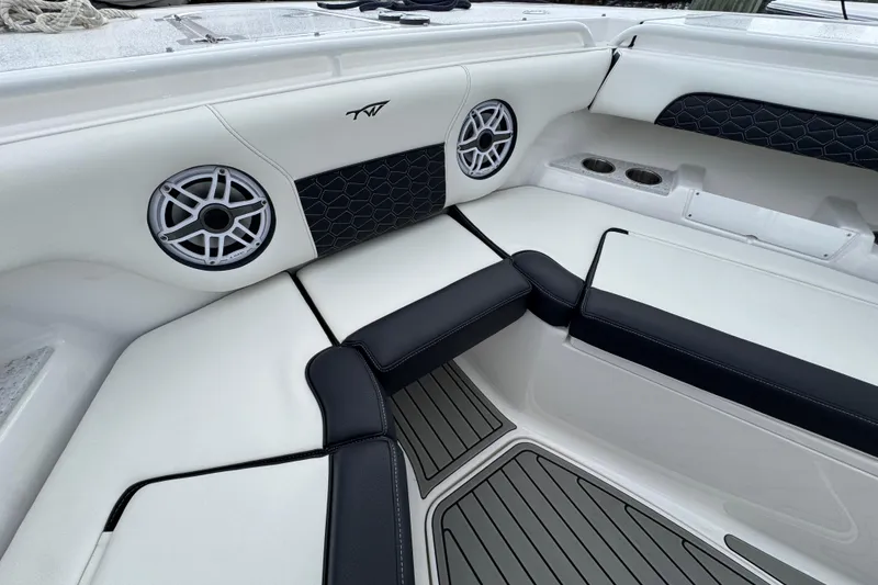 Slide: The Image of 2025 Tidewater 302 CC Adventure boat interior with speakers and cushioned seating. - 85