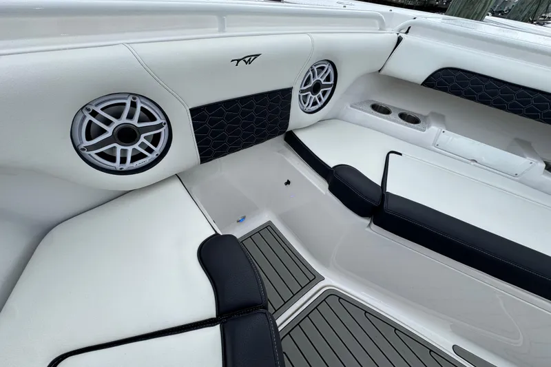 Slide: The Image of 2025 Tidewater 302 CC Adventure boat interior with speakers and seating. - 86