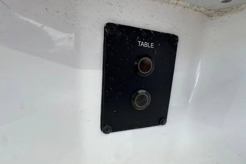Slide: The Image of Control panel on 2025 Tidewater 302 CC Adventure boat, labeled "TABLE." - 90