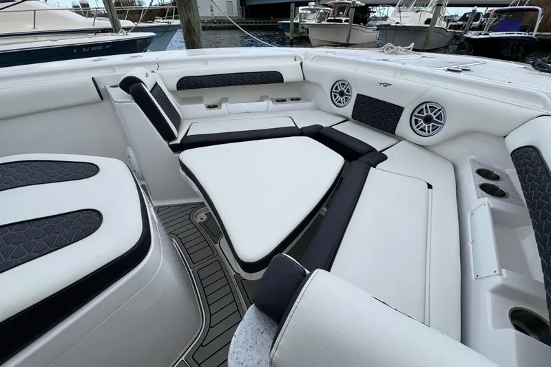 Slide: The Image of 2025 Tidewater 302 CC Adventure boat interior with luxurious seating and modern design. - 97