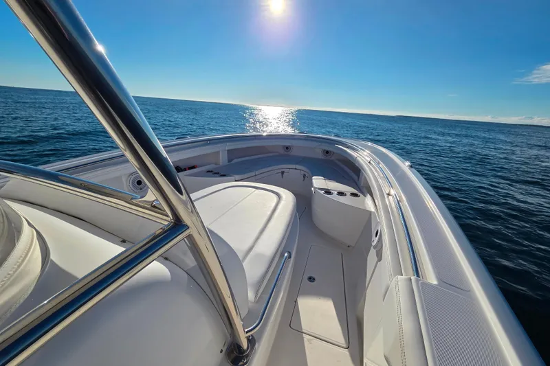 Slide: The Image of 2022 Mag Bay 33 CC boat on open sea under clear blue sky. - 16