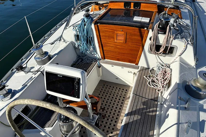 Slide: The Image of Cockpit of 1986 Beneteau First 42 sailboat with ropes and navigation equipment. - 4