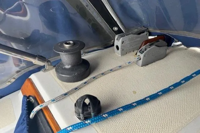Slide: The Image of Deck equipment on a 1982 Catalina 38 sailboat, featuring winch and cleat. - 17