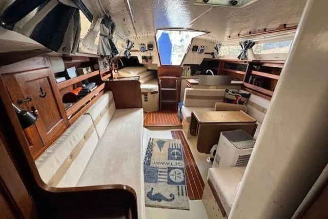 Slide: The Image of Interior of a 1982 Catalina 38 sailboat with cozy seating and nautical decor. - 20